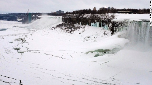 Ice forms on the Niagara River in front of the American Falls on the left and the Canadian Horseshoe Falls on the right on Wednesday, February 5.