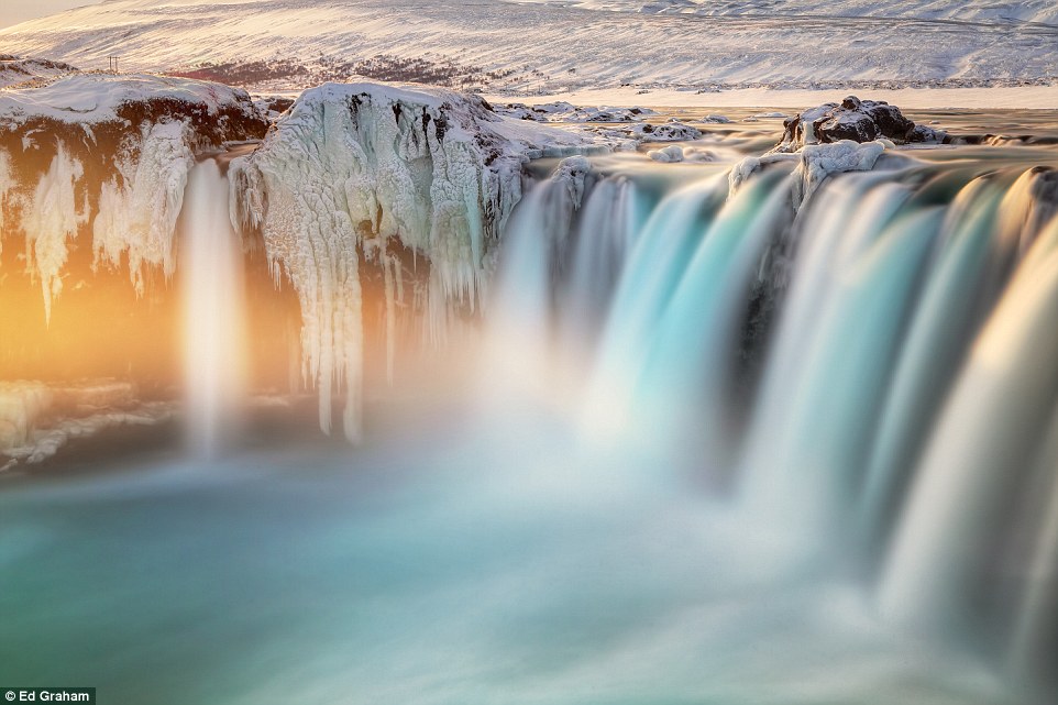 I had a tripod set up on Godafoss waterfall in Iceland last month. I used a 10 stop ND filter to capture the movement of the water as the sun set in the distance