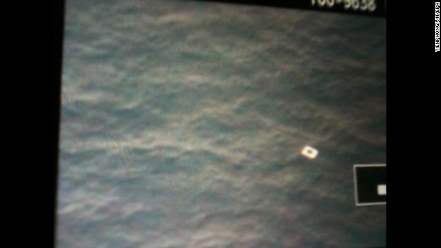 A photo taken by personnel on board a Vietnamese search aircraft in an undisclosed area on March 9 shows possible debris from the missing Malaysia Airline jet.