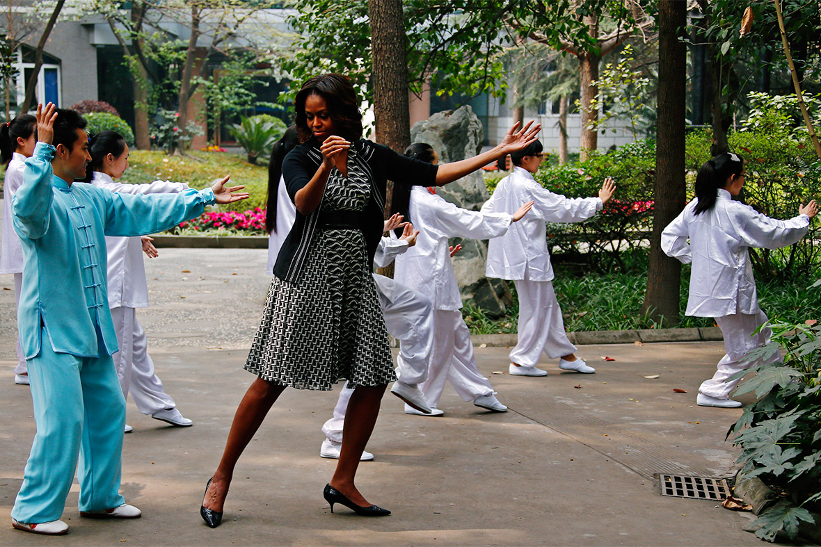 US first lady Michelle Obama practises tai chi with students at Chengdu No 7 High School in Chengdu, Sichuan province, China
