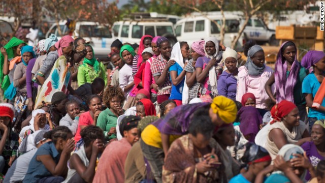 Displaced women wait in line inside a U.N. camp in Malakal on December 30. 