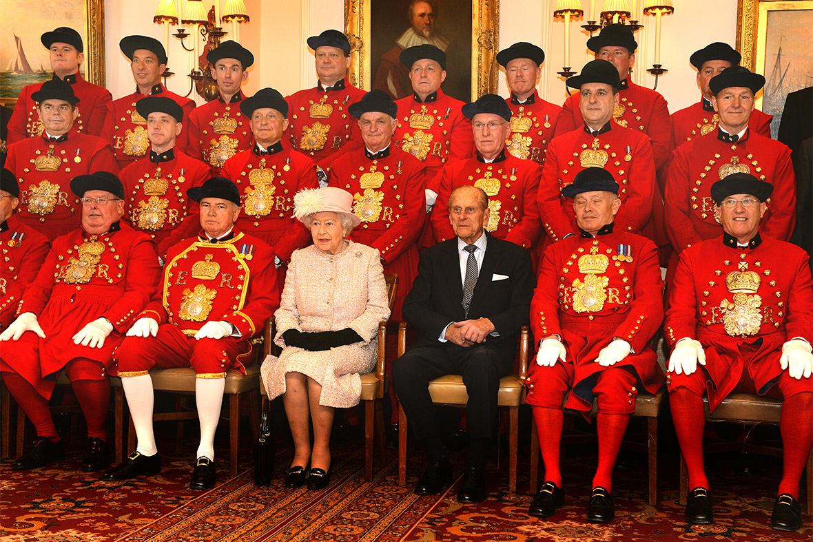 The Queen and Duke of Edinburgh pose with Watermen and Lightermen of the Thames during a reception at Waterman's Hall in the City of London, to celebrate the 800th anniversary of the Royal Watermen