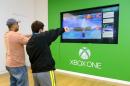 Men interact with the Xbox One gaming system at Bridgewater Commons Mall in New Jersey on November 23, 2013