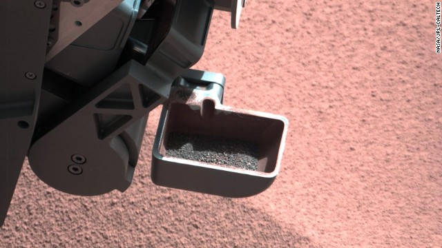 The rover's scoop contains larger soil particles that were too big to filter through a sample-processing sieve. After a full-scoop sample had been vibrated over the sieve, this portion was returned to the scoop for inspection by the rover's mast camera.