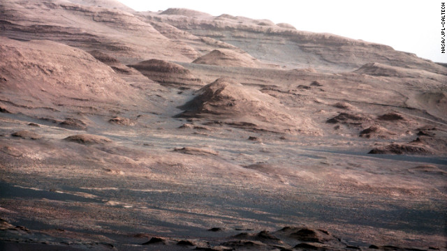 An image released August 27, 2012. was taken with Curiosity rover's 100-millimeter mast camera, NASA says. The image shows Mount Sharp on the Martian surface. NASA says the rover will go to this area. 