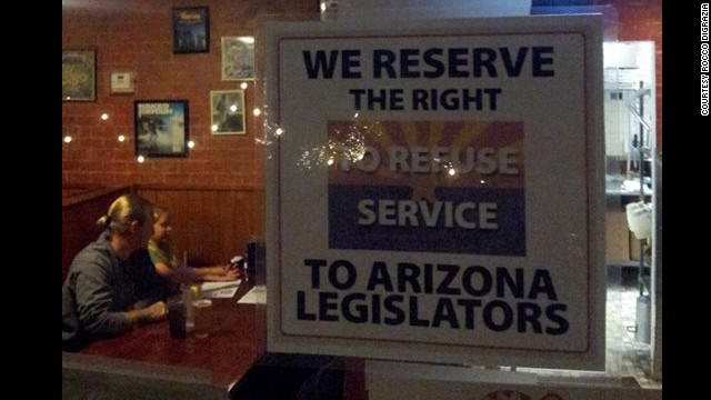 Rocco DiGrazia put this sign up in his Tucson, Arizona, pizzeria after state legislators passed anti-gay legislation.