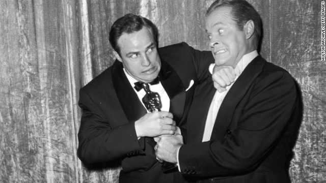 Oscars host Bob Hope, right, might have tried, but there was no way Marlon Brando was parting with his best actor award at the 1955 ceremony. Brando had lost three years in a row before then, but the actor's luck finally changed with "On the Waterfront." 