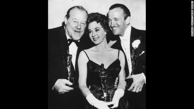 David Niven, right, joins fellow Oscar winners Burl Ives and Susan Hayward at the 1959 ceremony after winning the best actor award for "Separate Tables." The actor fought off competition from Tony Curtis and Sidney Poitier, both up for "The Defiant Ones"; Paul Newman in "Cat on a Hot Tin Roof"; and Spencer Tracy in "The Old Man and the Sea." 