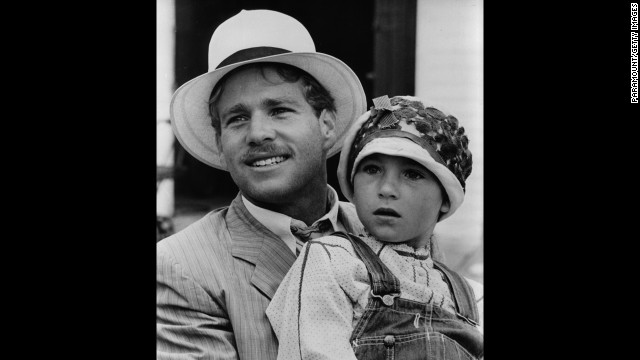 Tatum O'Neal, being held by father Ryan, is the youngest winner of an acting category. She was 10 when she won best supporting actress for "Paper Moon" (1973).