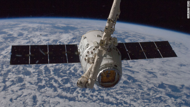The unmanned SpaceX Dragon spacecraft connects to the space station in May 2012. It was the first private spacecraft to successfully reach an orbiting space station.