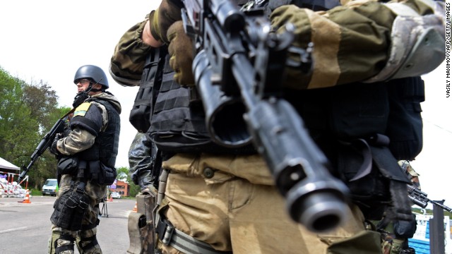 Ukrainian soldiers stand at a checkpoint near Slovyansk on May 5.