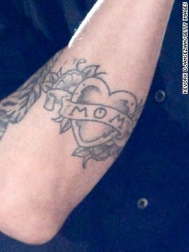 Levine's mom tattoo near his elbow.