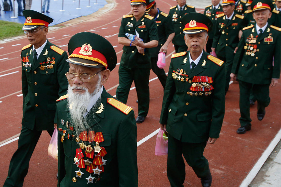 Veterans march during the 60th anniversary of the Dien Bien Phu battle, when Viet Minh forces over-ran the French garrison after a 56-day siege, forcing the French government to abandon its colonial rule in Indochina.