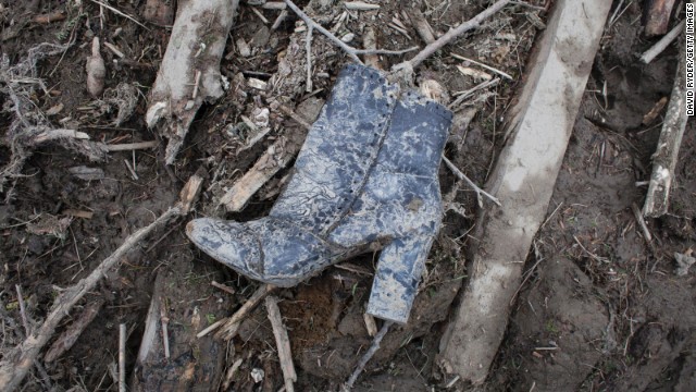 A boot is found among the debris on March 25.