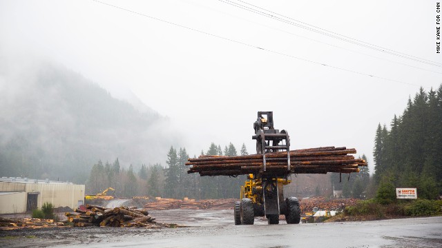 Timbers are moved at a lumberyard just outside of Darrington on Saturday. Darrington's economy is largely dependent on the logging and timber injuries, which took a hit in the 1970s. The town has never fully recovered.