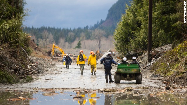 Rescue personnel work the site of the landslide on Saturday.