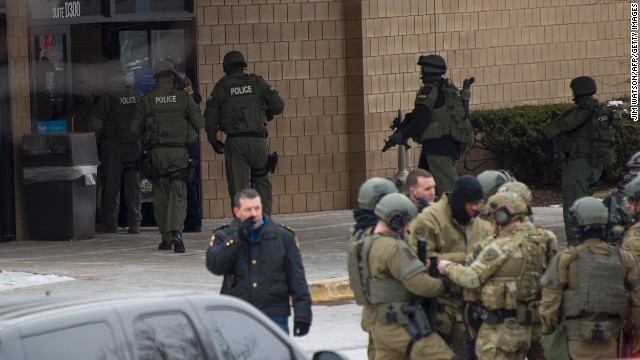 Police enter the Sears department store.