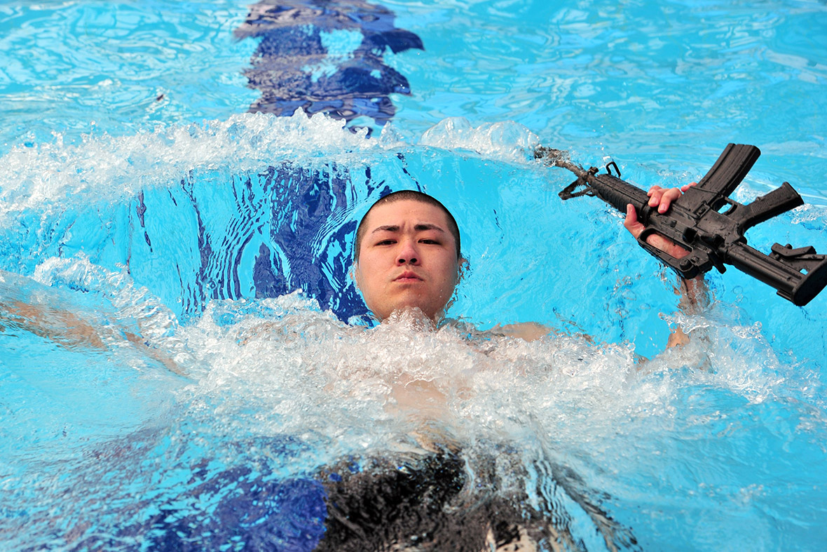 A soldier participates in a water survival test during the joint US-Korea 2014 Best Warrior Competition at Camp Casey in Dongducheon, north of Seoul