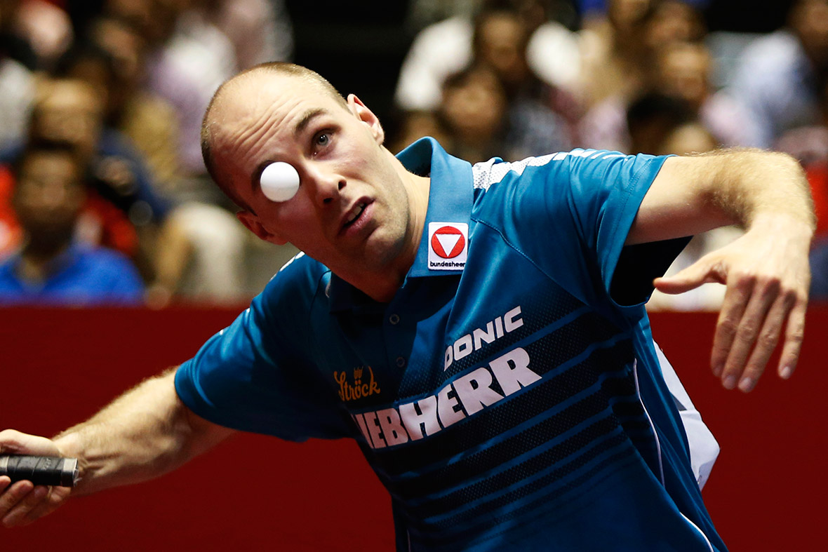 Austria's Daniel Habesohn eyes the ball as he serves to China's Ma Long during their men's quarter final match at the World Team Table Tennis Championships in Tokyo.