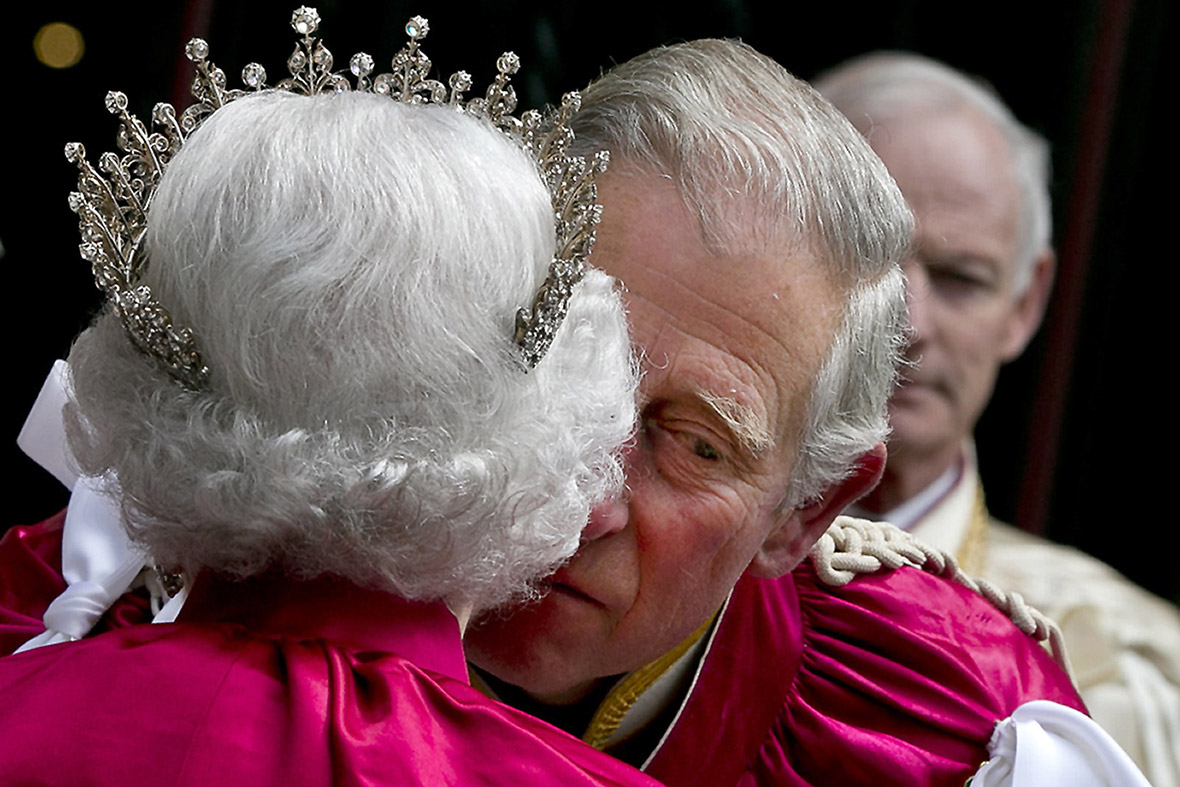Prince Charles kisses his mother to bid farewell as she departs Westminster Abbey after attending Order of the Bath Service.