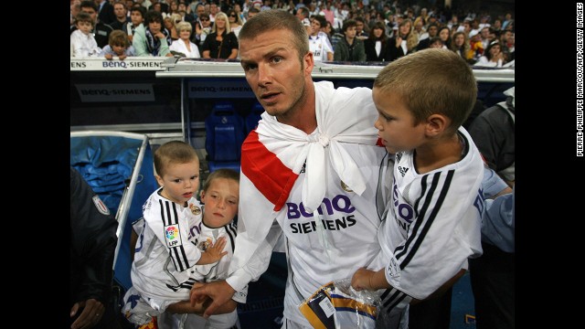 The midfielder celebrates with his sons in 2007 after Real Madrid won the Spanish League title by beating Mallorca.