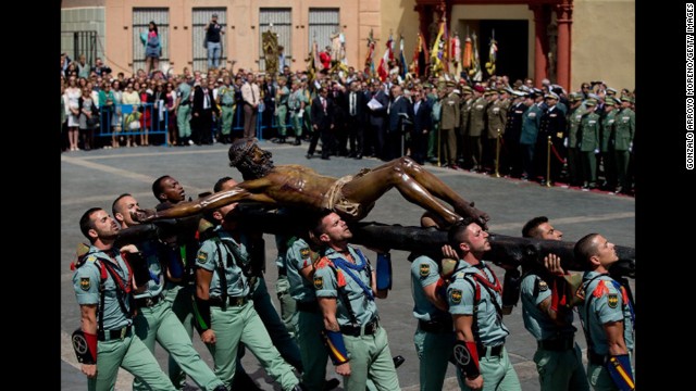 Members of the Spanish Legion carry a statue of Christ of Mena on April 17 in Malaga, Spain.