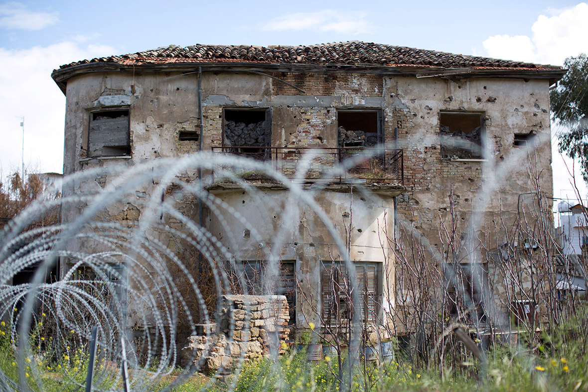 A former residential property stands abandoned in the United Nations buffer zone