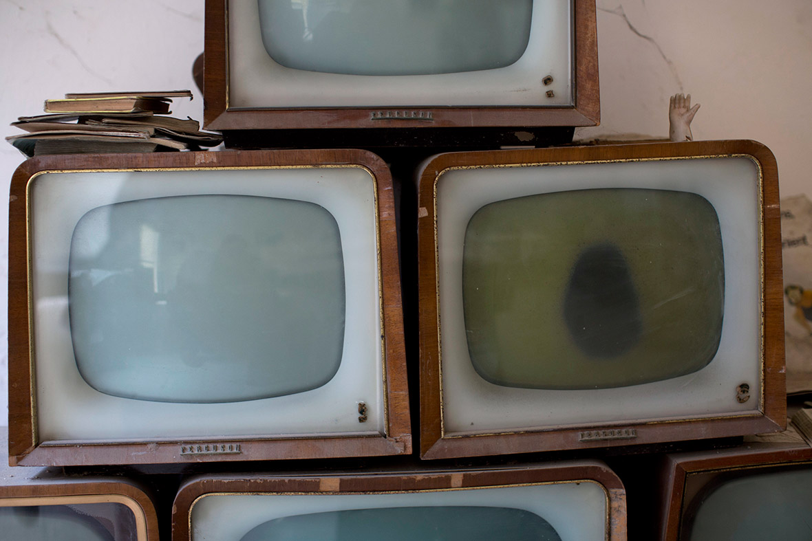Old TV sets collected by soldiers are seen in an abandoned commercial area