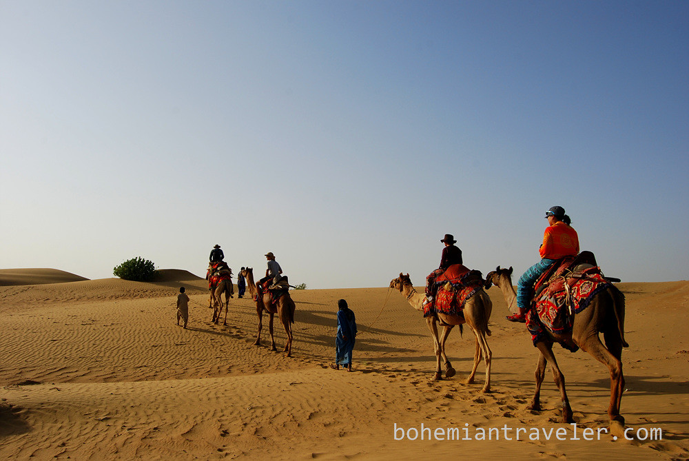 Thar desert camel train safari tourists (3)