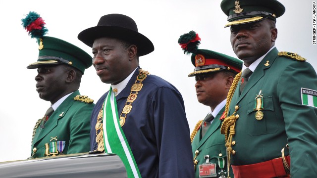 Nigerian President Goodluck Jonathan, second from left, stands on the back of a vehicle after being sworn-in as President during a ceremony in the capital of Abuja on May 29, 2011. In December 2011, Jonathan declared a state of emergency in parts of the country afflicted by violence from the militant Islamist group.