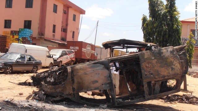 A photo taken on June 18, 2012, shows a car vandalized after three church bombings and retaliatory attacks in northern Nigeria killed at least 50 people on June 17 and injured more than 130 others, the Nigerian Red Cross Society said. 