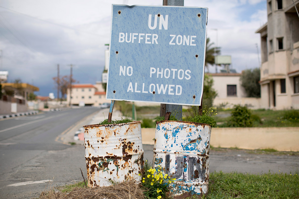 A sign marks the boundary of the United Nations buffer zone in the village of Pyla, home to a mixed community of both Greek and Turkish Cypriots