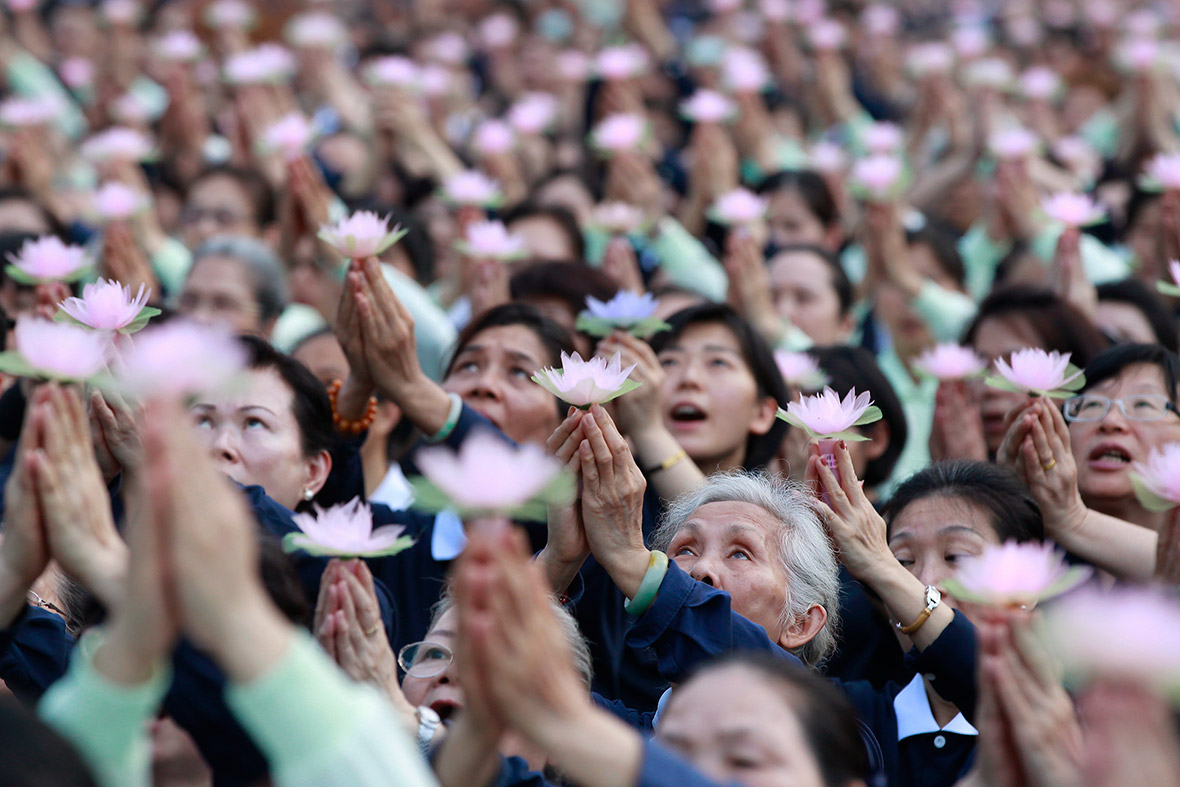 Buddhists pray during a ceremony to commemorate the birth of Buddha, at the Chiang Kai-shek Memorial Hall in Taipei