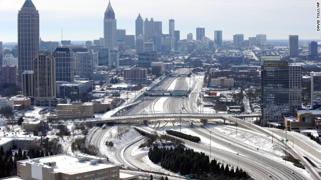 The ice-covered interstate highways running through Atlanta are empty on Wednesday, January 29, after a snowstorm hit the city a day earlier. A wave of arctic air that started over the Midwest and Plains spread to the Southeast, bringing snow, freezing ice and sleet to a region not familiar with such weather.