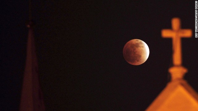 A total lunar eclipse is seen in Karachi, Pakistan, on December 10, 2011. It was the last full lunar eclipse.
