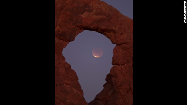 The December 2011 eclipse is seen near Moab, Utah. The moon takes on a reddish color as it passes through the Earth's shadow, which is the color of a desert sunset.