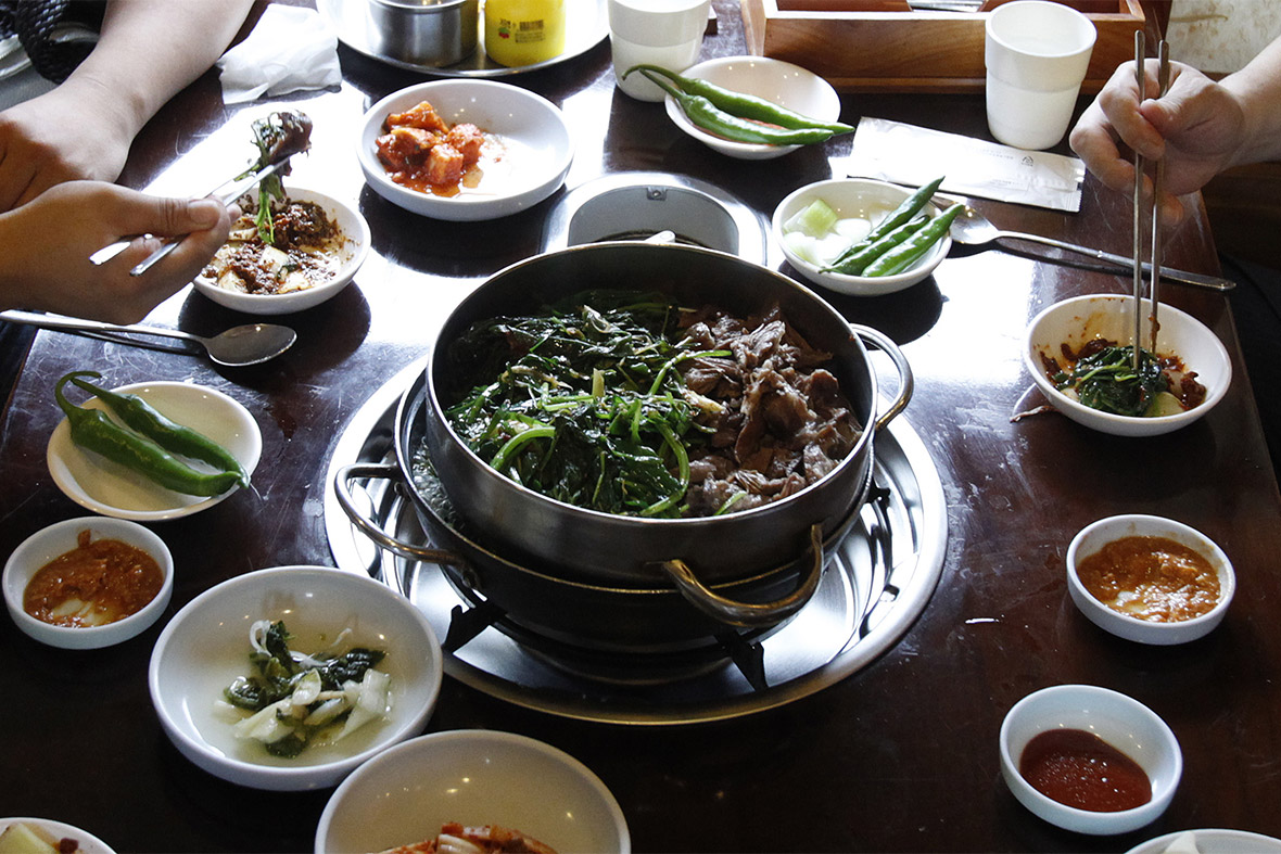 People eat dog meat at a restaurant in Seoul, South Korea