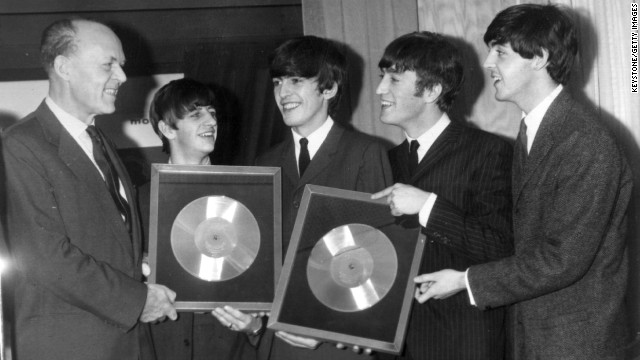The Beatles released their first album, "Please Please Me," in the United Kingdom on March 22, 1963. Here, the band is honored on November 18, 1963, for the massive sales of albums "Please Please Me" and "With the Beatles."