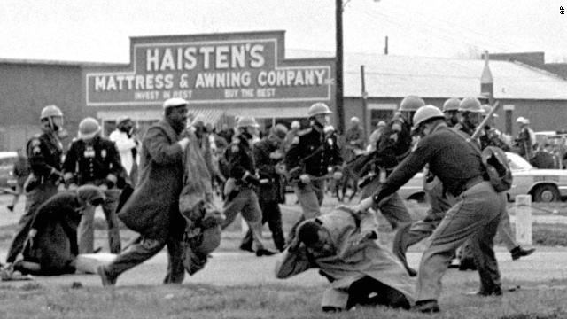 State troopers swing batons to break up a civil rights voting march in Selma, Alabama, on March 7, 1965. "Bloody Sunday," as it became known, helped fuel the drive for passage of the Voting Rights Act of 1965. 