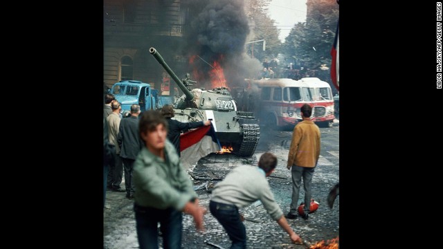 Residents of Prague, Czechoslovakia, throw burning torches in an attempt to stop a Soviet tank on August 21, 1968. A Soviet-led invasion by Warsaw Pact troops crushed the so-called Prague Spring reform and re-established totalitarian rule.