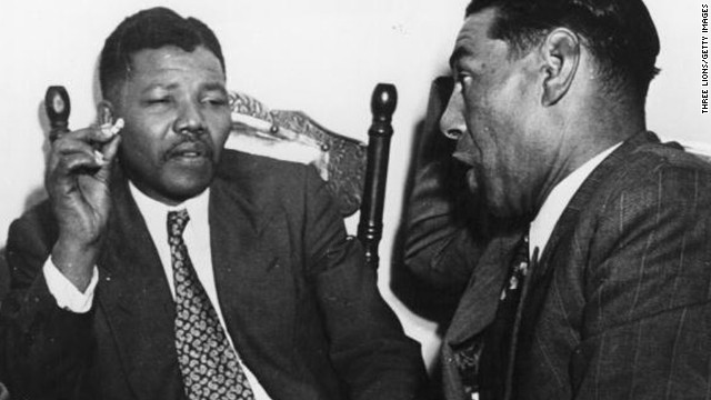 South African resistance leader Nelson Mandela, left, talks to Cape Town teacher C Andrews in 1964. On June 12, 1964, Mandela was sentenced to life in prison for four counts of sabotage. He was released 27 years later, and when apartheid ended he became the country's first black president.