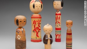 Kokeshi dolls are characterized by lack of arms and legs and brightly painted floral or geometric designs.