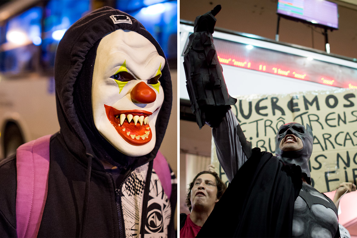Protesters wearing masks demonstrate against the 2014 FIFA World Cup Brazil in Rio de Janeiro