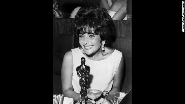 Elizabeth Taylor is seen with her Oscar after being named best actress for her part in "Butterfield 8."