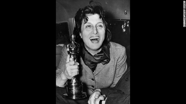 Anna Magnani enthusiastically holds the Oscar she won for "Rose Tattoo." The award was presented to her by U.S. Ambassador Clare Luce at the Villa Taverna in Rome. 