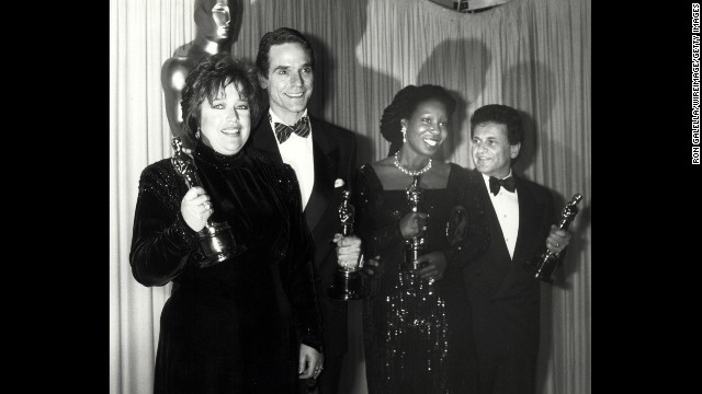 Kathy Bates, far left, clutches the best actress award for her role in "Misery." To her left are fellow Oscar winners Jeremy Irons, Whoopi Goldberg and Joe Pesci. 