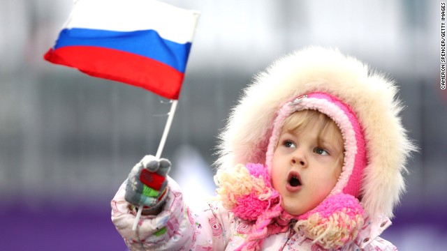 A young child waves a Russian flag on February 10.