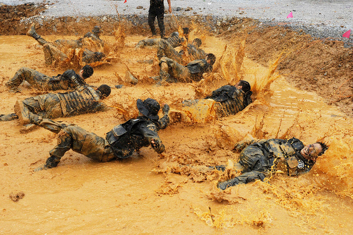 Police officers from a Swat team take part in a survival drill in Qiannan prefecture, southwest China's Guizhou province.
