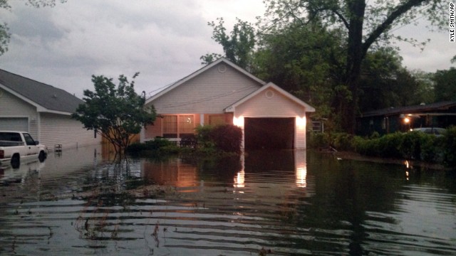 Floodwaters surround a home in Pensacola on April 30. 