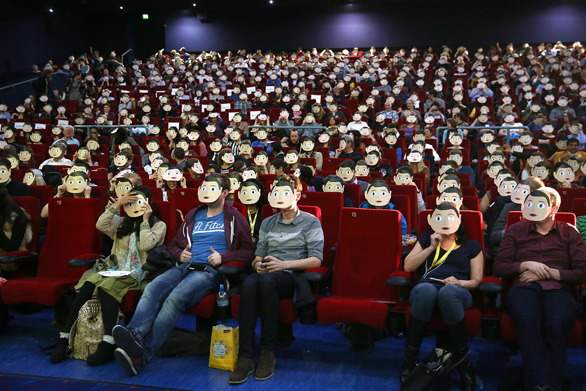 People wear Frank Sidebottom masks at a 'Frank' screening at Sundance London Film and Music Festival 2014 at the O2 Arena